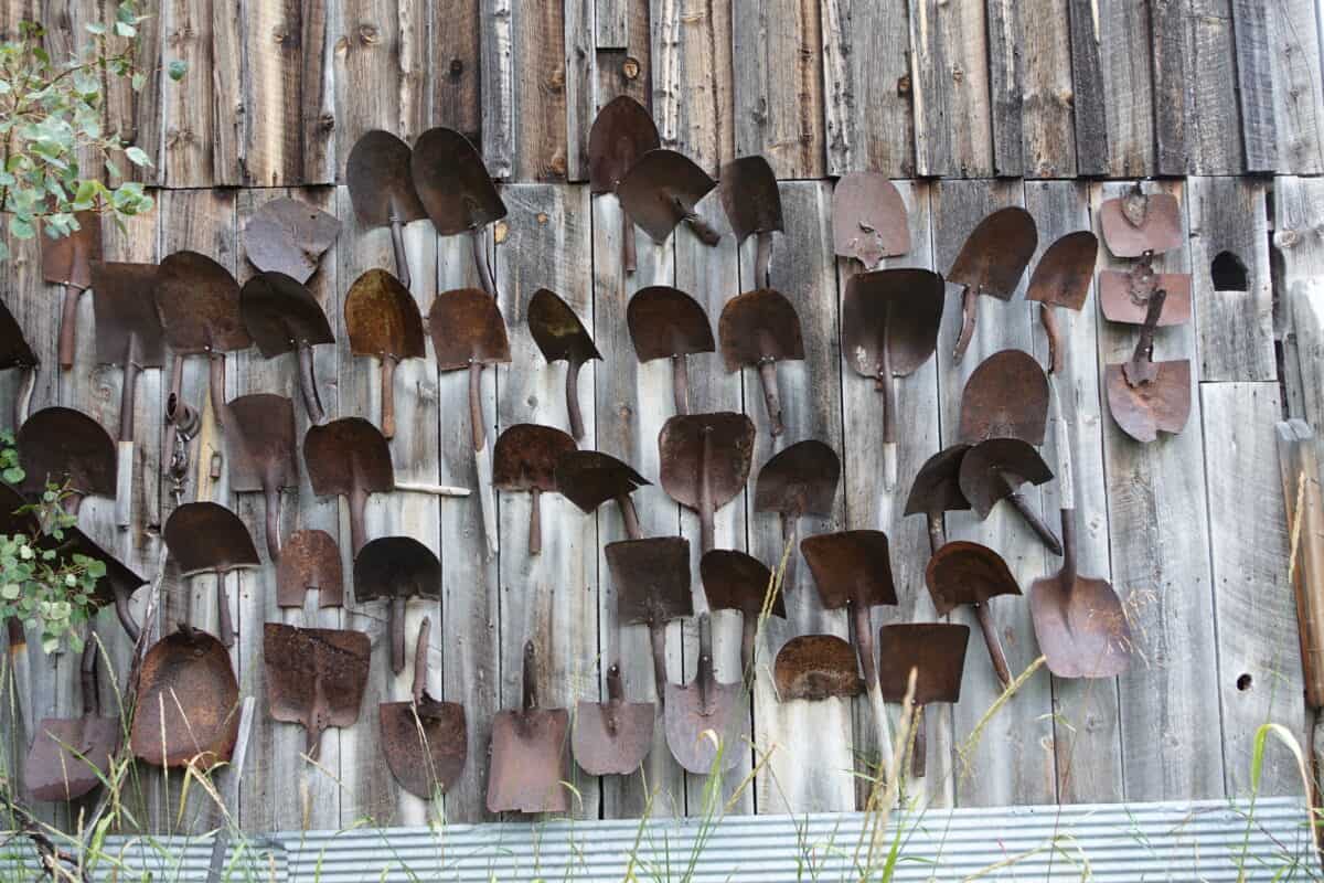 Rusted shovels on a barn wall in Marysville, Montana. Remnants of the gold mining  period from 1870-1900.