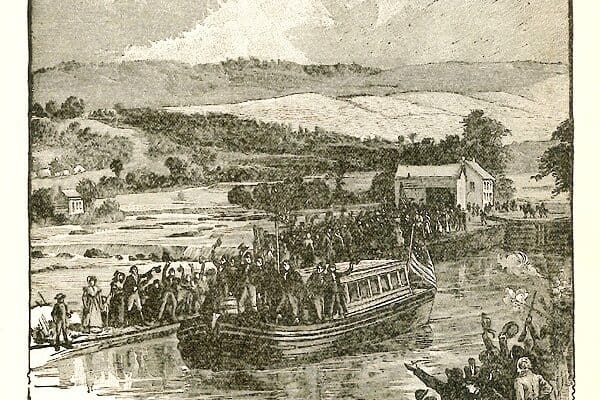 Opening of the Erie Canal, in 1825. A barge filled with people waving at onlookers on the shore.